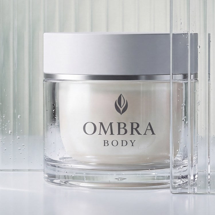 The OMBRA BODY jar standing against fluted glass.