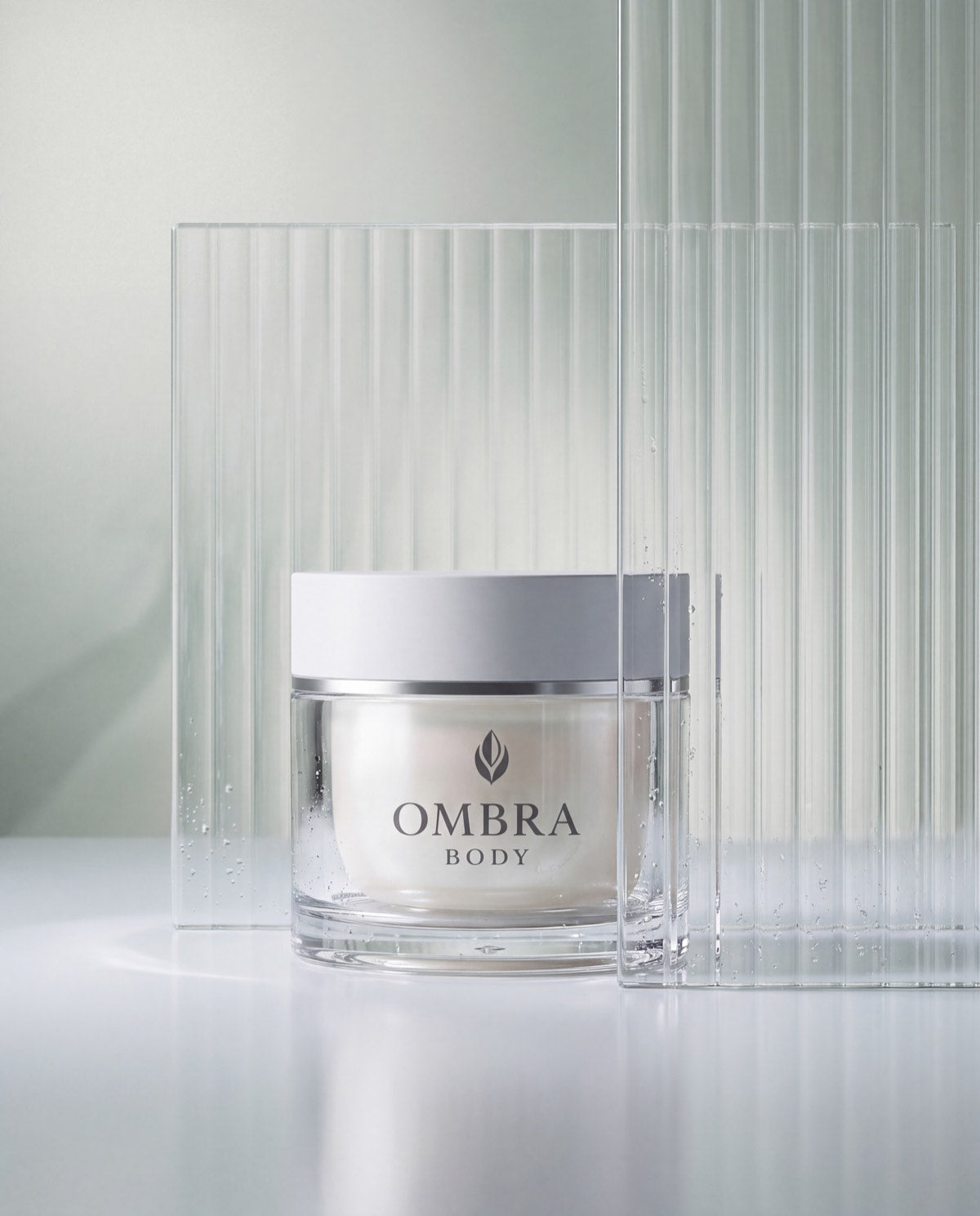 The OMBRA BODY jar standing among panels of fluted glass.